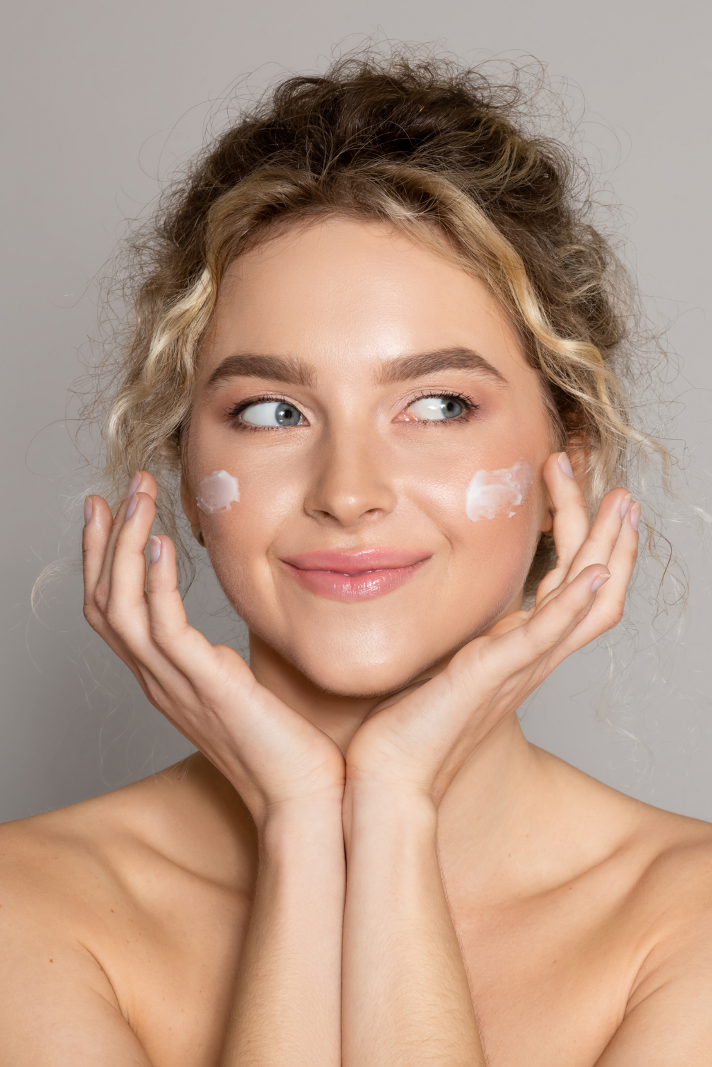 woman applying face cream